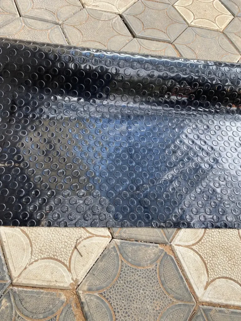 Close up of raised coins on heavy duty rubber coin mat